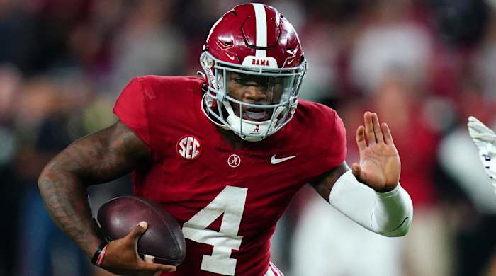 Alabama quarterback Jalen Milroe runs the ball